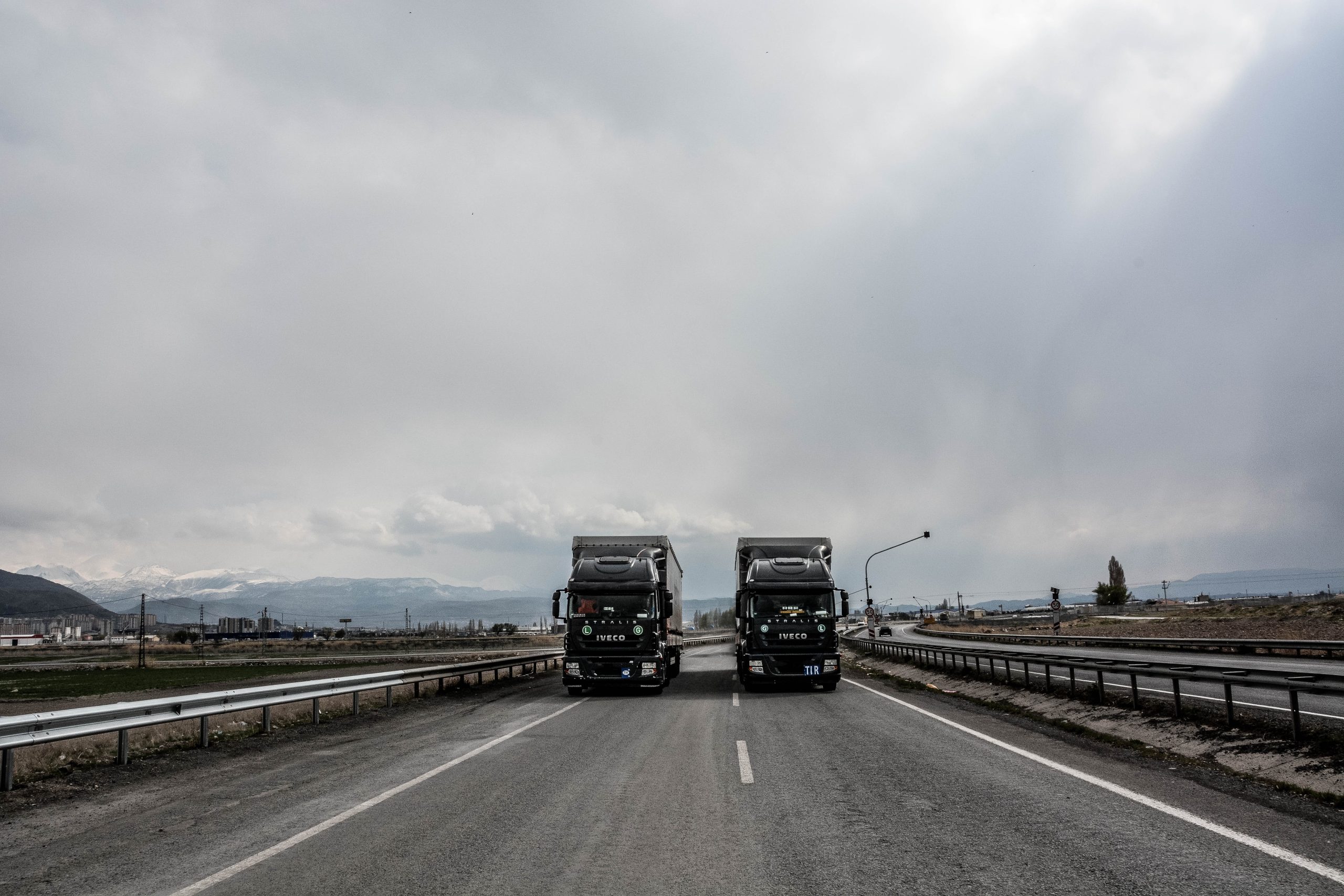 two trucks on road